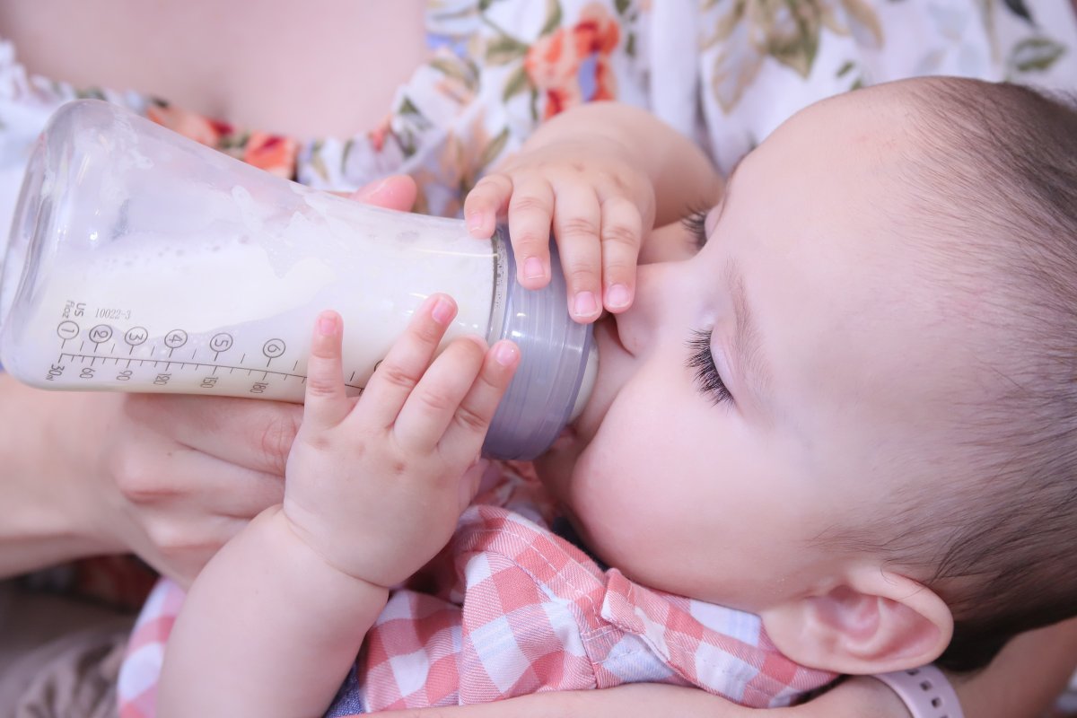 A baby drinking a bottle 